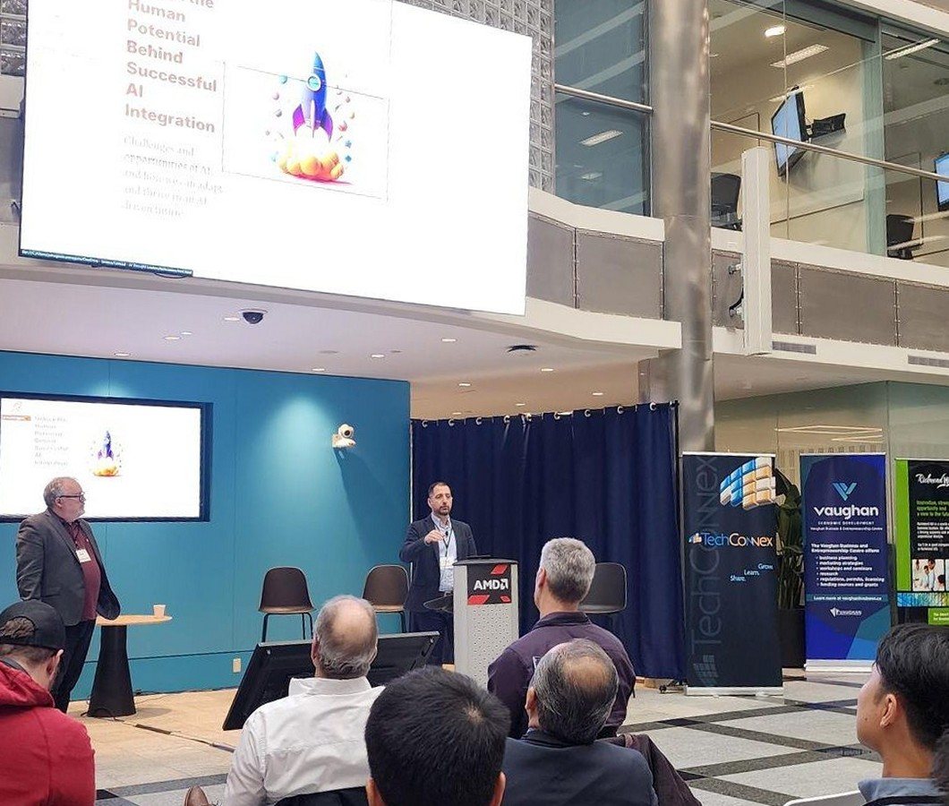 Kent Peel and Panos Panagiotakopoulos presenting to an audience at TechConnex